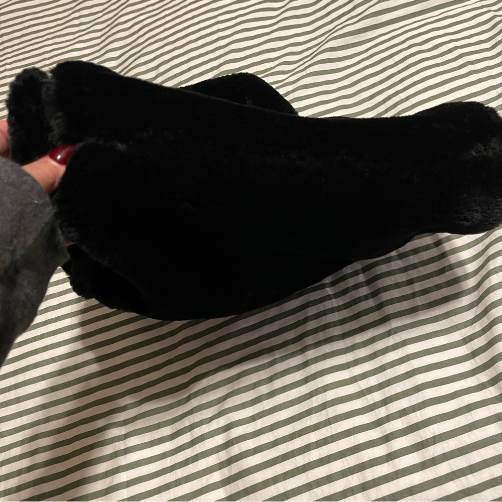 Brand new never used lined faux fur bag.